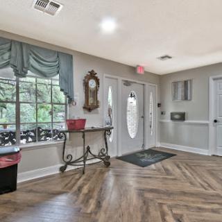A welcoming entryway featuring stylish decor and natural light.