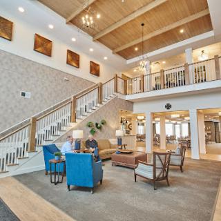 A beautifully designed lobby featuring modern furniture, elegant lighting, and an inviting atmosphere.