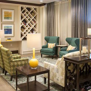 A cozy living room with elegant furnishings and warm lighting.