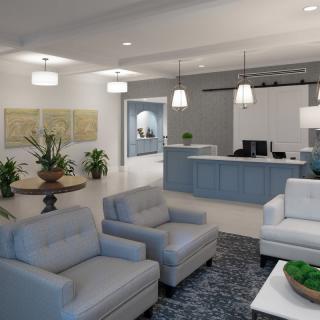 A modern reception area with comfortable seating, stylish lighting, and indoor plants.