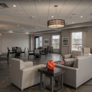 A modern lounge with comfortable seating and stylish lighting.
