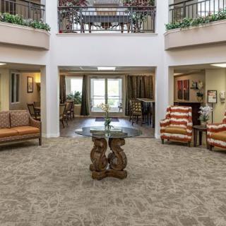 A spacious lobby with comfortable seating areas and elegant decor.