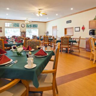 A well-arranged dining room with tables set for service.