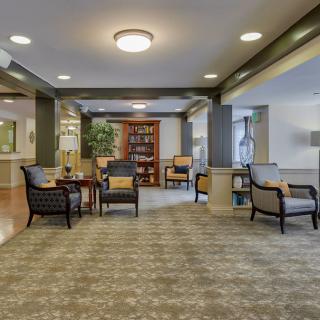 A spacious lobby with comfortable seating and a well-lit interior.