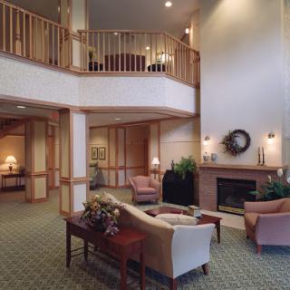 A cozy and welcoming lobby area with comfortable seating and warm decor.