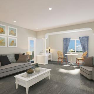 A modern living room with stylish furniture and ample natural light.