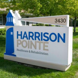 A sign for Harrison Pointe Healthcare & Rehabilitation Station.