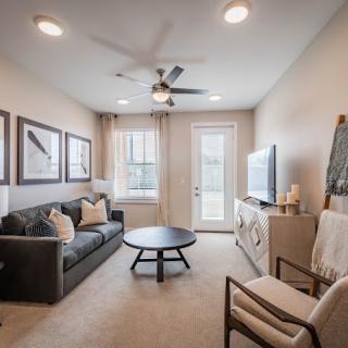 A modern living room with a comfortable sofa, coffee table, and stylish decor.