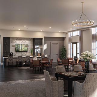 A modern dining area with elegant seating and a chandelier.