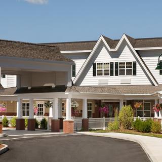 A large residential building with an inviting entrance and driveway.