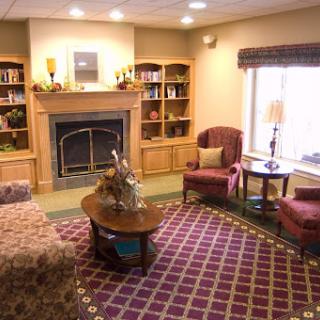 A cozy living room featuring a fireplace and comfortable seating, perfect for relaxation.