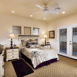 A cozy bedroom with elegant furniture and soft lighting.