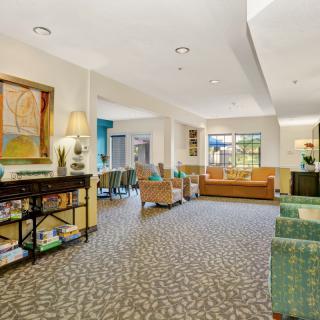 A cozy lounge area with comfortable seating and warm decor.