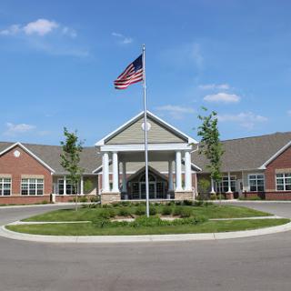 A well-designed community building featuring an American flag.