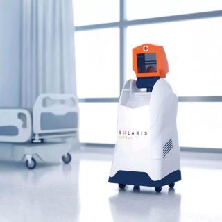 A medical robot in a hospital setting, designed to assist with healthcare tasks.