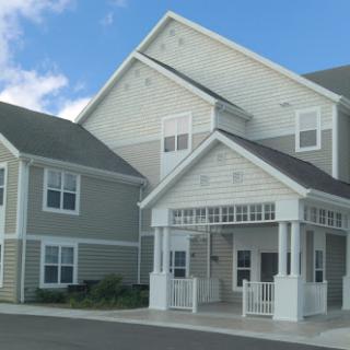 A welcoming building with a distinct entrance area and modern architectural design.