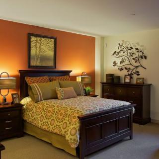 A cozy bedroom with warm colors and elegant furniture.