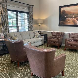 A cozy living room with comfortable seating and elegant decor.