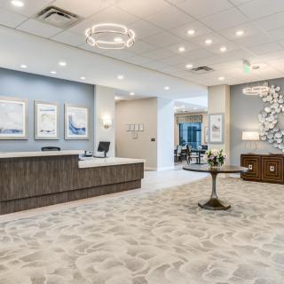 A modern reception area with stylish decor and comfortable seating.