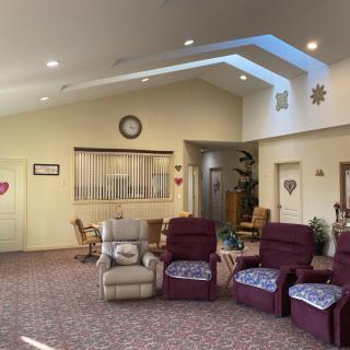 A cozy living room with comfortable recliner chairs and soft lighting.