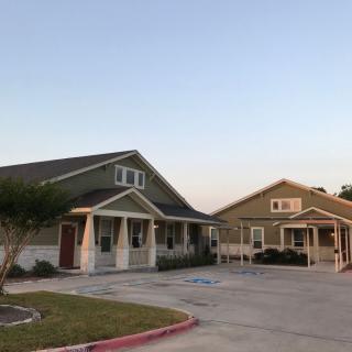 Two suburban houses side by side in a residential neighborhood.