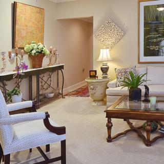 A cozy living room with elegant furniture and tasteful decor.