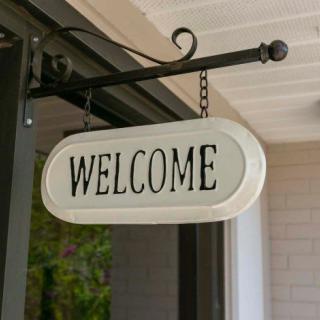 A welcoming sign hanging at the entrance.