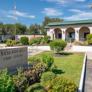 Exterior view of a care center with landscaped grounds.