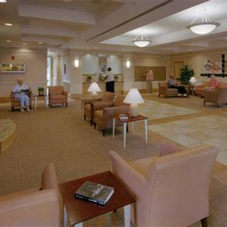 A spacious and comfortable lobby area with various seating arrangements and soft lighting.