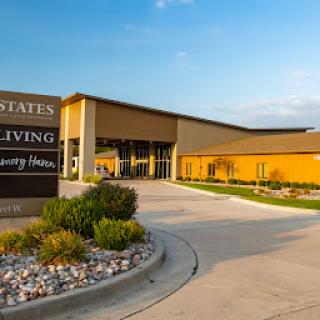 A modern senior living facility with a welcoming entrance.