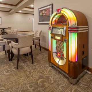 A retro jukebox in a cozy dining area.