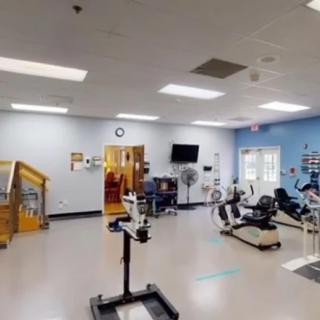 A well-equipped fitness center with various exercise machines and equipment.