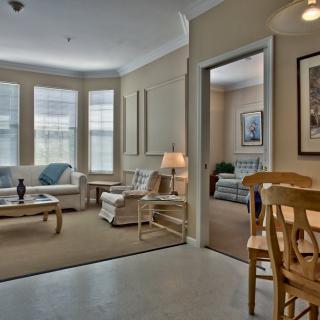A cozy living room with comfortable seating and natural light.