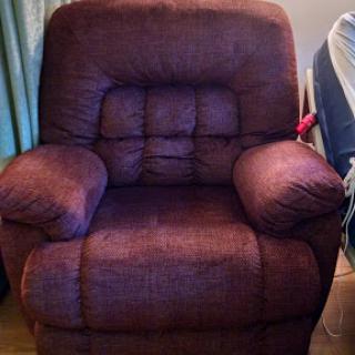 A plush purple recliner chair, perfect for relaxing in any living space.