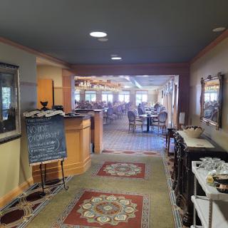 A view of the dining area from the hallway, showcasing a warm and inviting atmosphere.