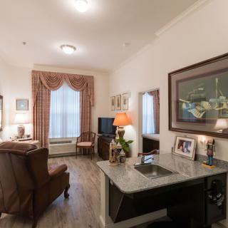 A cozy living room with elegant furnishings and decor.