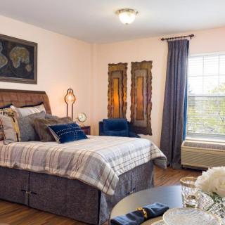 A cozy and modern bedroom with stylish decor and comfortable furnishing.