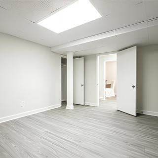 A bright, empty room with modern design and natural lighting.
