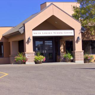 Entrance to a public library and community center on a clear day.