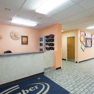 A welcoming reception area with a front desk and hallway.