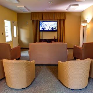 A cozy living room with comfortable seating and a television.
