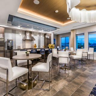 A modern and luxurious kitchen and dining area with sleek design elements.