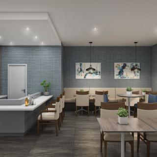 Modern dining area with sleek decor and cozy seating.