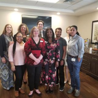 A cheerful group of professionals gathered for a memorable occasion.