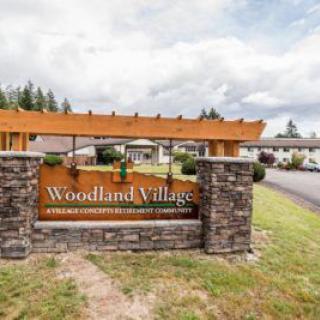 Entrance sign for Woodland Village neighborhood.