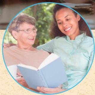Two people enjoying a book together outside.