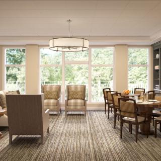 Bright dining room with large windows and traditional furniture.