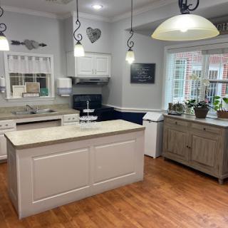 A beautifully designed modern kitchen featuring an island countertop and stylish decor.