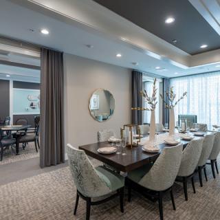 A modern and elegant dining room with stylish furnishings and a sophisticated table setting.