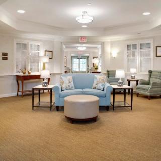 A modern lobby with comfortable seating and ambient lighting.